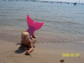 Woman jumping on beach