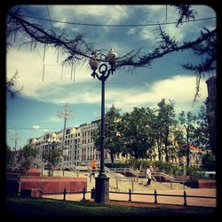 City street against cloudy sky