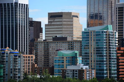 Modern buildings in city against sky