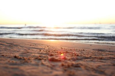 View of calm beach at sunset