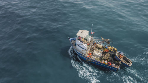 High angle view of ship sailing in sea