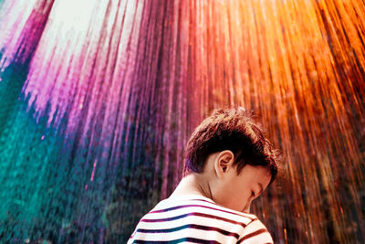 Portrait of boy looking away outdoors