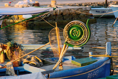 Fishing boats moored on lake at harbor