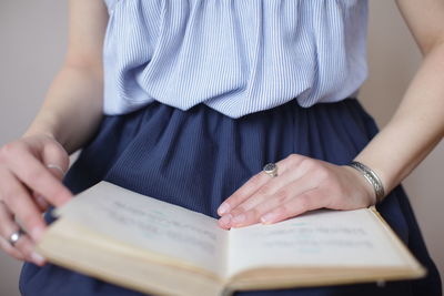 Close-up of woman holding book