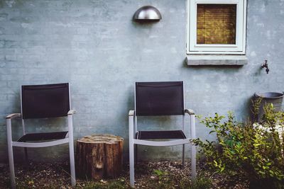Chairs by wall outside