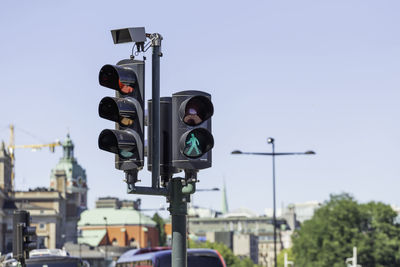 Traffic lights for cars and pedestrians on central streets of stockholm. street traffic in sweden.