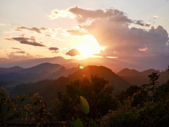 Scenic view of mountains against sky during sunset