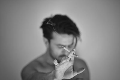 Portrait of man smoking cigarette