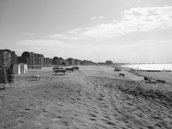 Scenic view of beach against sky in city