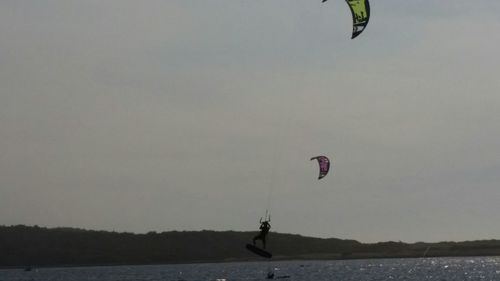 Low angle view of person jumping in mid-air