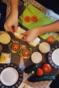 High angle view of man preparing food on table