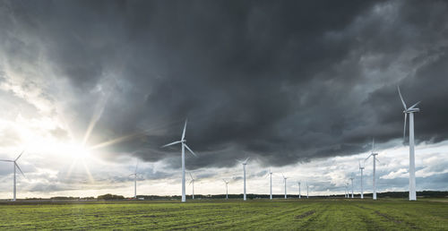 Wind turbines under stormy sky