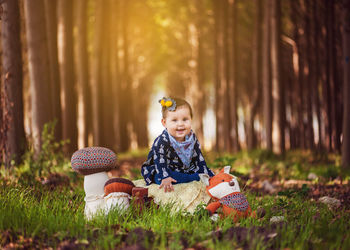 Portrait of boy playing on grass