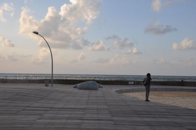 Scenic view of sea against cloudy sky