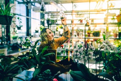 Woman sitting on plant