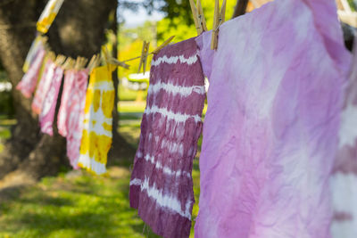 Colorful abstract tie dyed fabric hung up to dry.