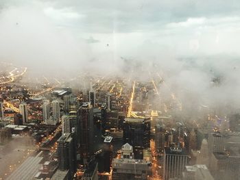 Aerial view of cityscape against sky