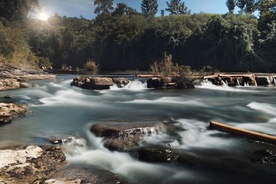 Scenic view of river stream against sky