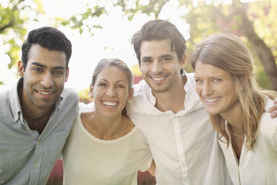 Portrait of four happy people outdoors