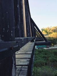 Close-up of footbridge against sky