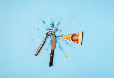 Directly above shot of food on table against blue background