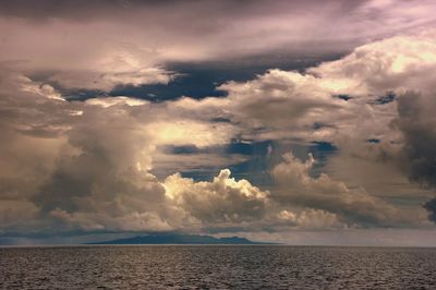 Scenic view of sea against cloudy sky