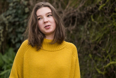 Portrait of beautiful young woman in park