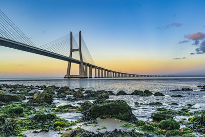 View of suspension bridge at sunset