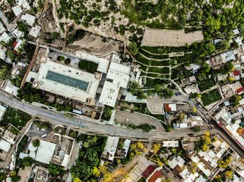 High angle view of buildings and trees in city