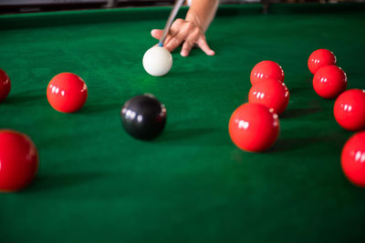 Person playing with ball on table