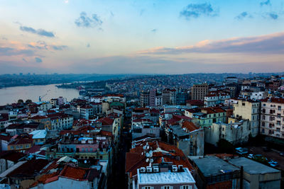 High angle shot of townscape against sky at sunset