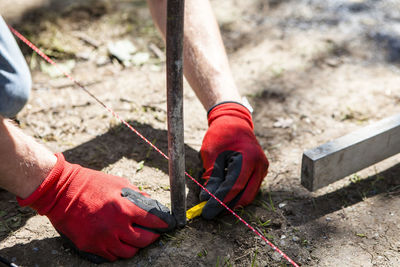 Close-up of man working at construction site