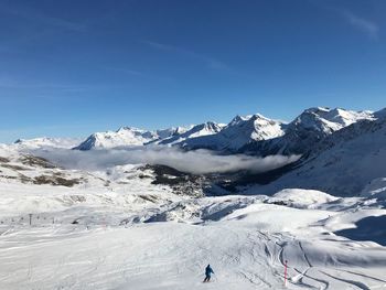 Scenic view of snowcapped mountains against sky