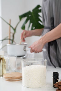 Creative occupation of candle making. woman making candles from soy wax, working in 