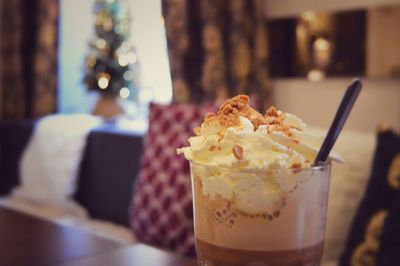 Close-up of coffe drink in glass on table