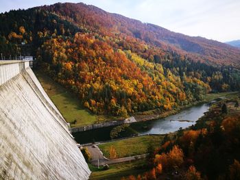 Scenic view of river amidst mountains during autumn