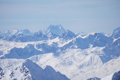 Scenic view of snowcapped mountains against sky