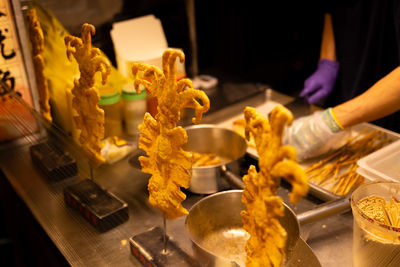 Midsection of man preparing food on table