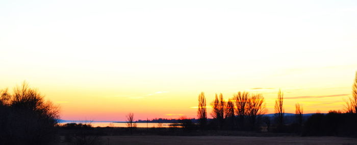 Scenic view of silhouette landscape against sky at sunset