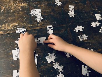 High angle view of people playing on table