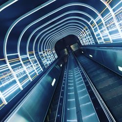 Tilt image of moving walkway in subway station