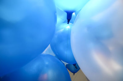 Close-up of blue helium balloons