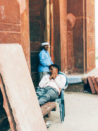Rear view of couple sitting on seat