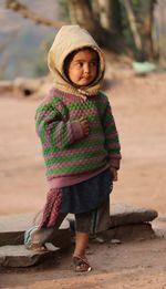 Portrait of girl wearing hat standing outdoors