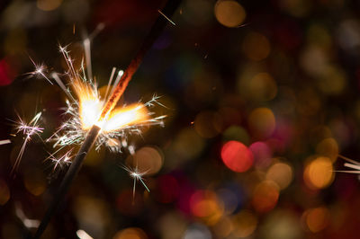 Close-up of sparkler at night