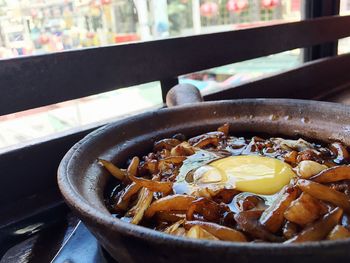Close-up of fresh food in cooking pan at restaurant