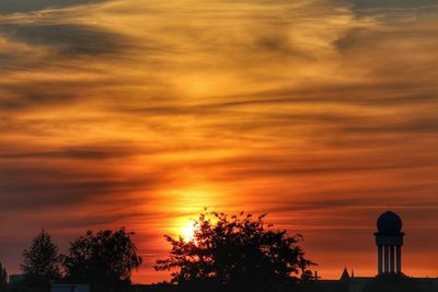 Low angle view of silhouette trees against sky during sunset