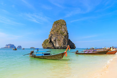 Panoramic view of rocks on beach against sky