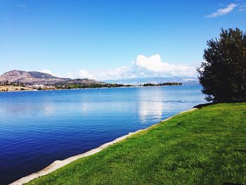 Scenic view of okanagan lake against sky