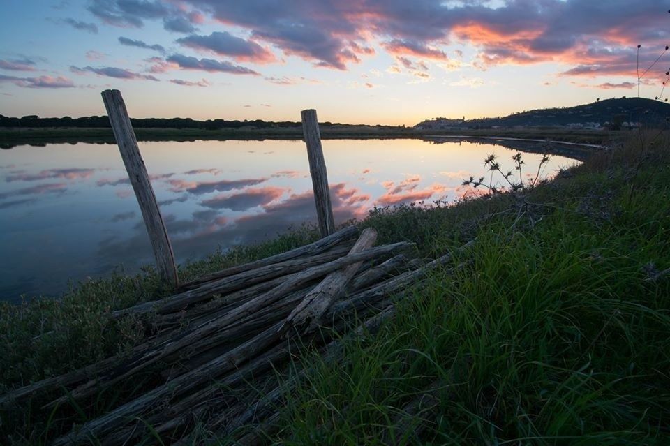 SCENIC VIEW OF LAKE AT SUNSET